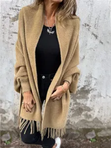 Details of the women's cozy faux mink fringe cape shawl, showing soft texture and batwing design.