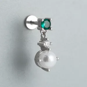 Macro view of S925 sterling silver flat back stud with green zircon and pearl drop