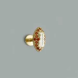 Orecchino piercing in argento 925 forma football con zirconi arancioni e dettagli di smalto.