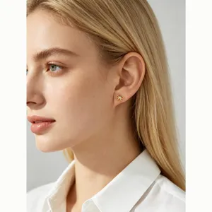 Elegant gold plated S925 sterling silver bow stud earrings with zircon on model