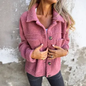Detail view of the cozy pink teddy fleece shacket for women, highlighting soft fluffy texture.