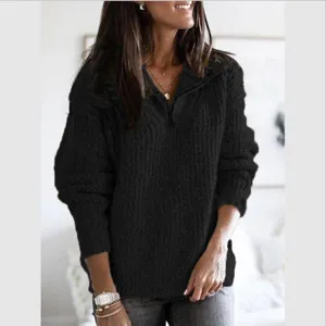 Detailed view of the women's black zip-up knit sweater, cozy long sleeves and stylish collar.