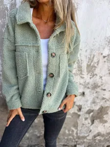 Green sherpa fleece jacket detail, fold-over collar, front buttons, soft winter outerwear.