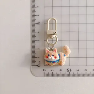 Cute cartoon cat keychain detail shot, creative bag charm and adorable accessory for students.