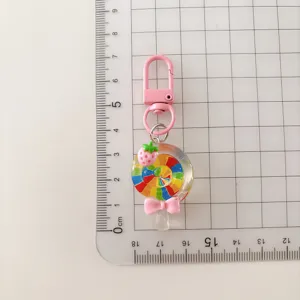 Colorful transparent lollipop keychain with cute strawberry charm and pink bow for cute daily accessories.