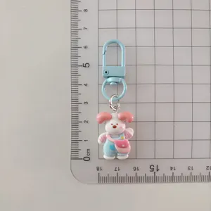 Cute cartoon puppy keychain detail, adorable overalls dog pendant for bags and school backpacks.
