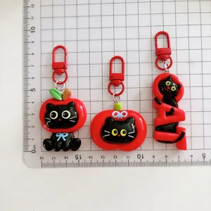 Cute cartoon black cat apple keychain set, creative resin bag pendant charms for gifts.