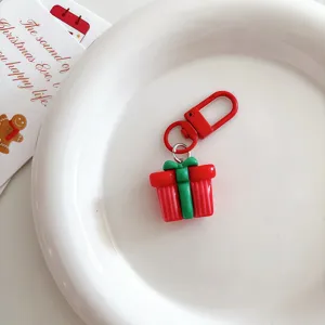 Christmas gift keychain pendant, red and green gift box design, cute bag charm accessory.