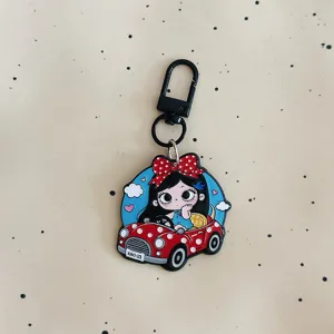 Cute big-eyed girl acrylic keychain with red polka dot car charm and black clasp.