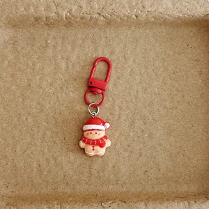 Detailed close-up shot of the cute Christmas gingerbread man keychain metal clasp.