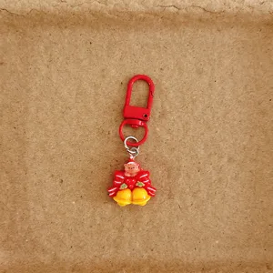 Lindo llavero navideño con osito y campanitas, colgante perfecto para bolso o regalo.