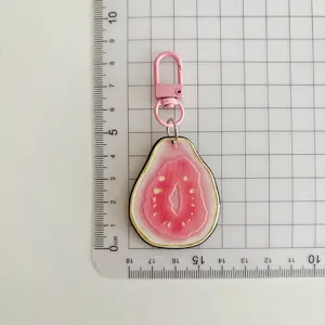 Cute fruit slice acrylic keychain with pink clasp, perfect bag charm gift for girls.