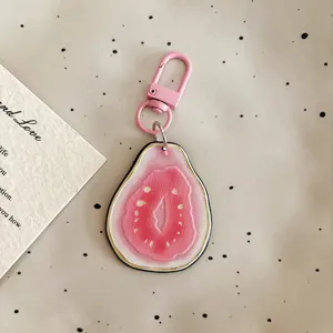 Cute pink guava fruit slice acrylic keychain pendant for women bags and keys charm.