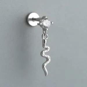 Macro view of S925 sterling silver labret with cubic zirconia and snake dangle