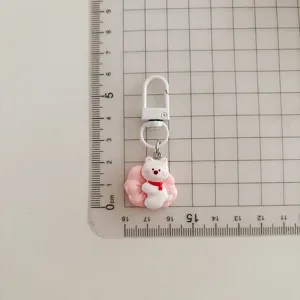 Cute West Highland white dog keychain detail view with metal clasp and pink charm