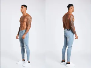 Men slim fit light blue casual denim jeans detail shot showing modern fashion styling.