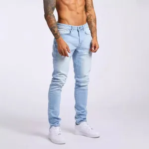 Men's light blue skinny stretch jeans, casual denim trousers for modern fashion styling.