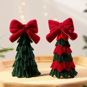 Mini fluwelen kerstboom tafeldecoratie met strik voor feestelijke vakantiehuisdecoratie.