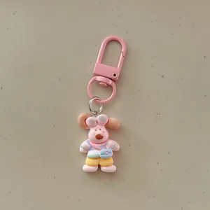 Cute cartoon puppy keychain with colorful outfit, perfect bag charm and keyring accessory.