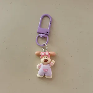 Cute cartoon puppy keychain with purple strap and adorable overalls design for bags.