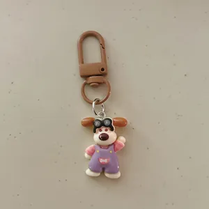 Cute cartoon dog keychain with overalls and goggles pendant for backpack accessory gift.