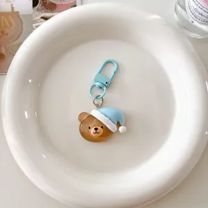 Cute cartoon sleeping bear keychain with light blue hook, stylish bag pendant accessory.