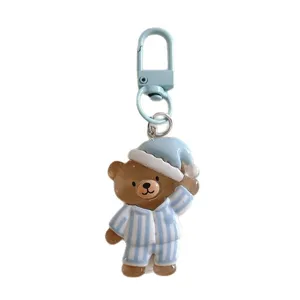 Cute cartoon sleeping bear keychain, blue striped pyjamas metal clasp bag pendant gift.