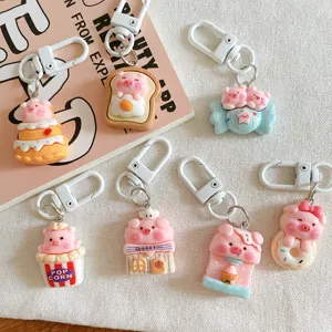 Cute cartoon pig keychains set, kawaii resin animal backpack pendants and bag charms for gifts.