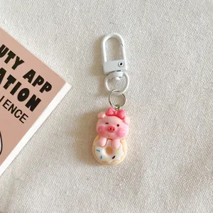 Cute cartoon pig donut keychain detail shot, sweet student gift and bag hanging ornament.