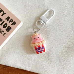 Cute pig keychain pendant, adorable cartoon popcorn bucket bag charm for girls and besties.