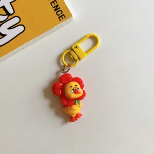 Mignon porte-clés de canard de dessin animé drôle pour sacs, accessoire élégant et cadeau.