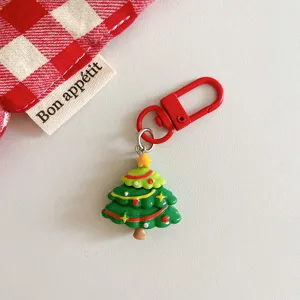 Christmas tree keychain pendant detail, cute holiday accessory for bags and keys.