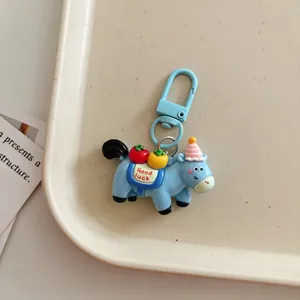 Cute cartoon horse keychain, lovely blue pony bag charm with fruit decor, student schoolbag accessory.