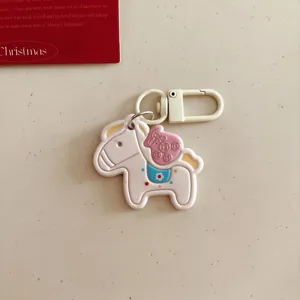 Cute cartoon horse keychain with money bag charm, perfect bag accessory and new year gift.