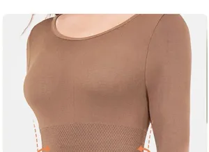 Close-up detail of the seamless thermal shapewear top showcasing tummy control waist design.