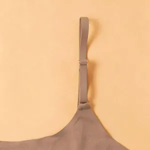 Close-up detail of the adjustable bra strap and metal buckle, showing smooth fabric.