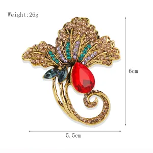 Gedetailleerd overzicht van de vintage goudkleurige blad broche met maten en gewicht.