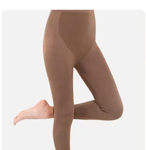 Detailed view of seamless thermal winter leggings, high waist brown warm tights.