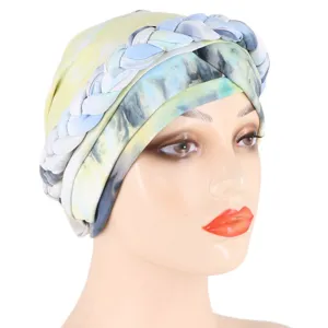 Detailed view of the tie-dye printed braided turban made from soft milk silk fabric.