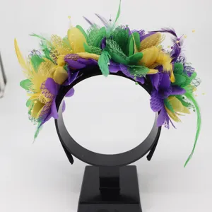 Detailed view of colorful festival feather flower headband with purple, green and yellow accents.