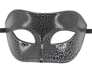Close-up detail of black silver crackle masquerade half mask with ribbon ties for party.