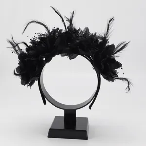 Detailed view of black feather floral headband, Halloween party hair accessory with lace design.