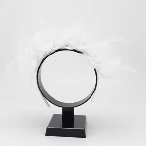 Stunning white feather flower headband for women party hair accessory detail shot.