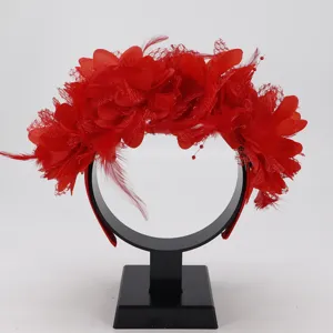 Detailed view of red feather flower headband for women party costume accessories headwear.