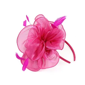 Detailed shot of hot pink organza feather fascinator headband for parties and cocktail events.