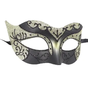 Venetian masquerade mask detail, exquisite black and gold glitter patterns and ribbon ties.