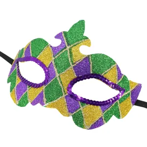 Glitter masquerade mask detail, Mardi Gras green purple gold diamond pattern with sequin eyes.
