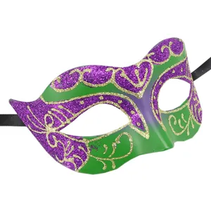 Close-up of a vibrant purple and green masquerade mask featuring sparkling gold glitter details.