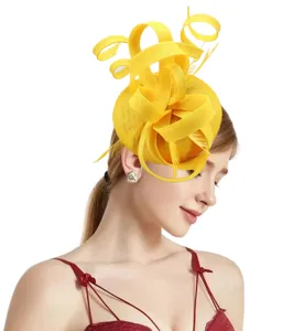 Yellow sinamay fascinator detail, feather hair accessory closeup, elegant wedding party hat