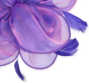 Detailed close-up of purple organza feather hair accessory showing fine texture and layer design.
